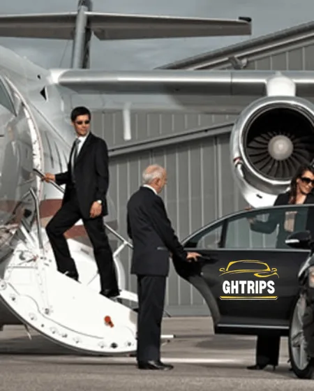 A private chauffeur picking up a traveler at Dubai International Airport.