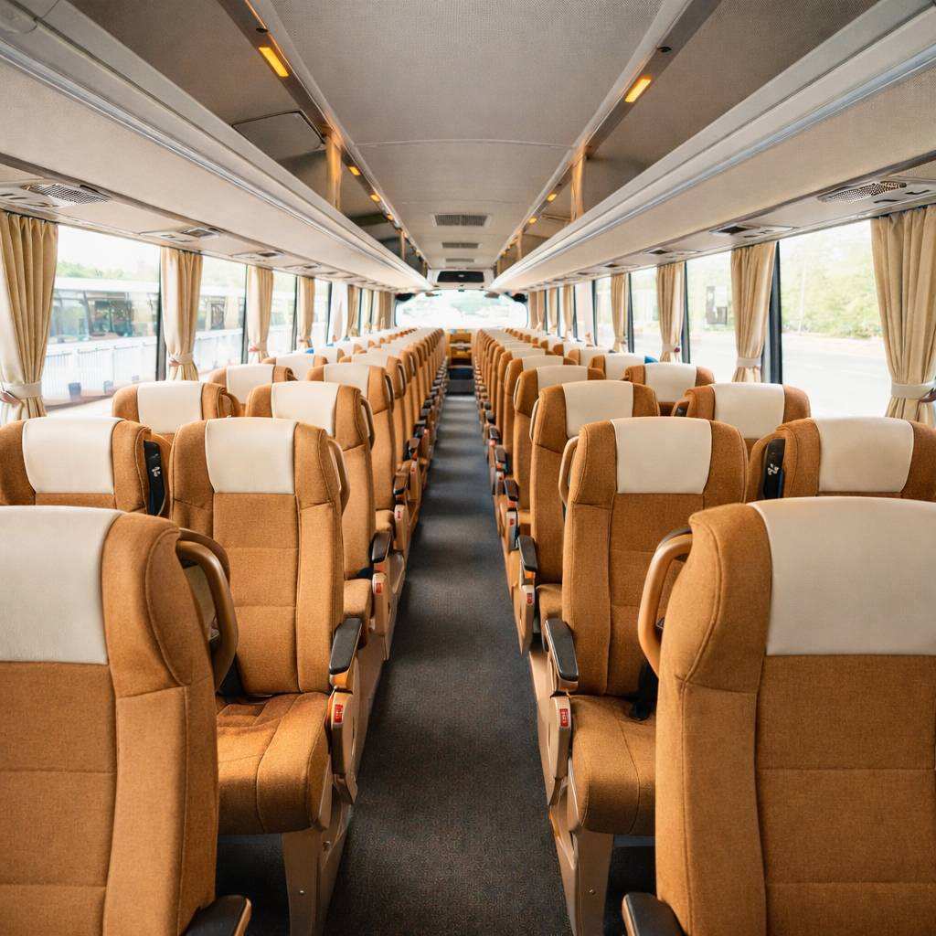 interior of 50 seater bus with reclining seats and AC