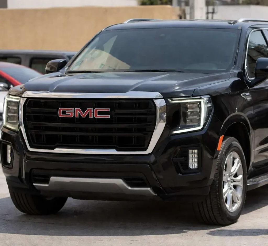 Professional Chauffeur Standing Beside Luxury Black SUV